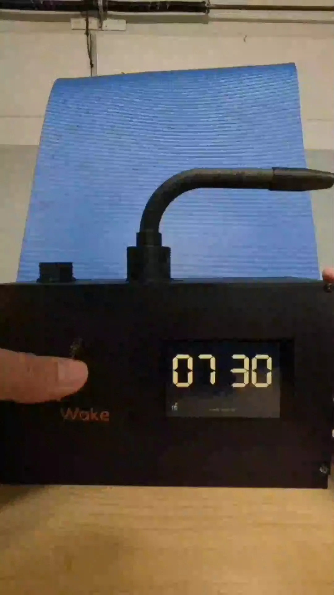 Working prototype: real handheld photo of the MistWake unit with its waterproof mat