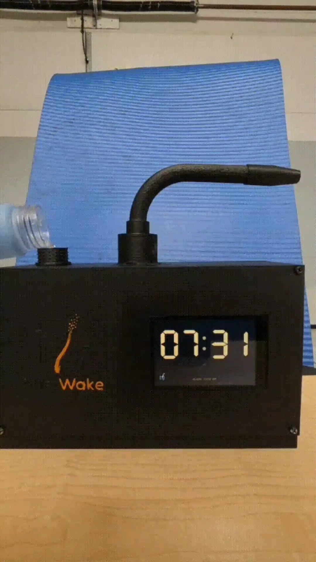 Working prototype: real photo of the MistWake unit on a wood surface